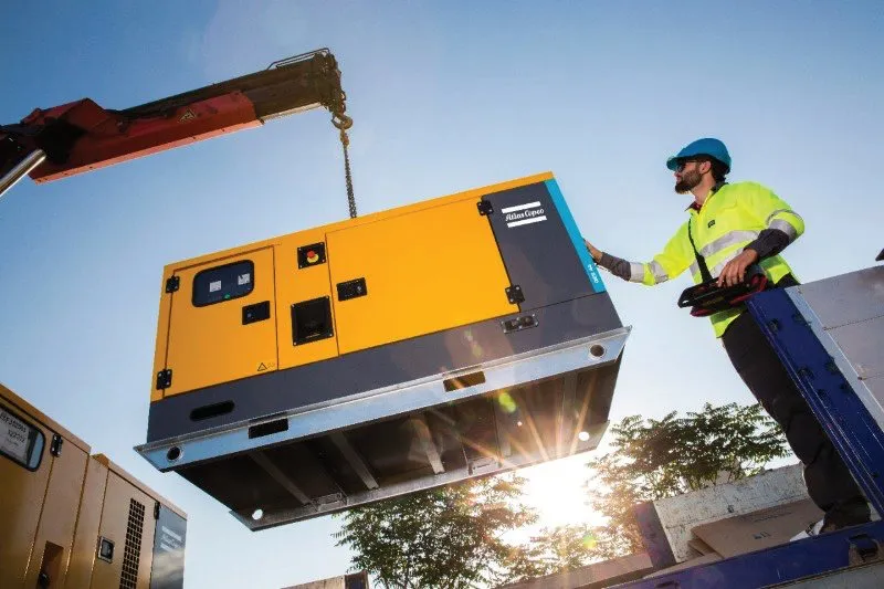 A generator being lifted into place (photo: Atlas Copco)