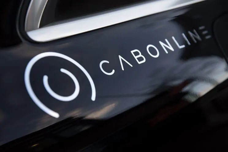 The Cabonline logo on a car door (photo: Cabonline)